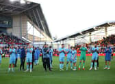 Newcastle United players celebrate the win at Brentford with the travelling supporters. (Photo by Luke Walker/Getty Images)