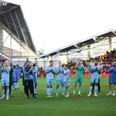 Newcastle United staff and players celebrate Saturday’s 2-0 win at Brentford.
