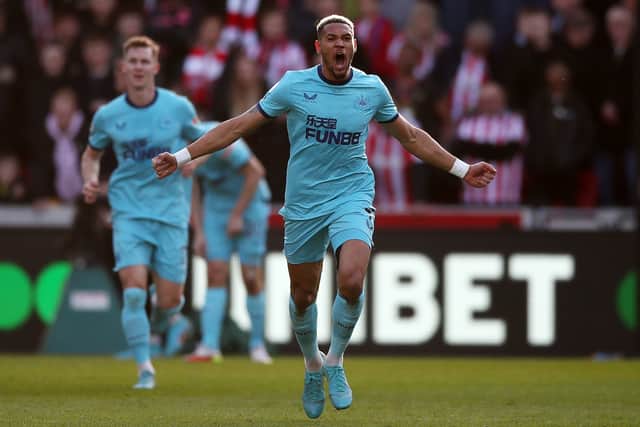 Joelinton of Newcastle United celebrates after scoring their team's first goal during the Premier League match between Brentford and Newcastle United at Brentford Community Stadium on February 26, 2022