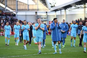 Matt Targett and Joe Willock of Newcastle United applauds fans after their sides victory during the Premier League match between Brentford and Newcastle United at Brentford Community Stadium