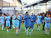 Matt Targett and Joe Willock of Newcastle United applauds fans after their sides victory during the Premier League match between Brentford and Newcastle United at Brentford Community Stadium