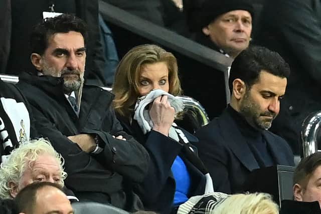 Newcastle United’s Saudi Arabian chairman Yasir Al-Rumayyan (L), Newcastle United’s English minority owner Amanda Staveley (C) and her husband Mehrdad Ghodoussi (R) look on during the English FA Cup third round football match between Newcastle United and Cambridge United at St James’ Park in Newcastle-upon-Tyne, north east England on January 8, 2022.