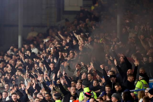 LEEDS, ENGLAND - JANUARY 22: Newcastle United fans celebrate their first goal during the Premier League match between Leeds United  and  Newcastle United at Elland Road on January 22, 2022 in Leeds, England. (Photo by George Wood/Getty Images)