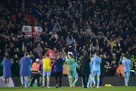Newcastle United celebrate with their fans after the final whistle of the Premier League match between Southampton and Newcastle United at St Mary's Stadium on March 10, 2022 in Southampton, England.  