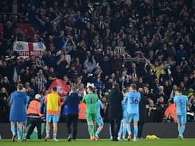 Newcastle United celebrate with their fans after the final whistle of the Premier League match between Southampton and Newcastle United at St Mary's Stadium on March 10, 2022 in Southampton, England.  