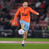 Jonjo Shelvey of Newcastle United warms up before the Premier League match between Southampton and Newcastle United at St Mary’s Stadium on March 10, 2022 in Southampton, England. 