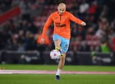 Jonjo Shelvey of Newcastle United warms up before the Premier League match between Southampton and Newcastle United at St Mary’s Stadium on March 10, 2022 in Southampton, England. 