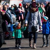 Passengers and Ukrainian refugees arrive with a ferry from Gdansk in Poland to the port of Nynashamn, about 60 km south of Stockholm, Sweden, on March 15, 2022. - More than three million people have now fled Ukraine since Russia invaded on February 24, the United Nations said on March 15, 2022. 