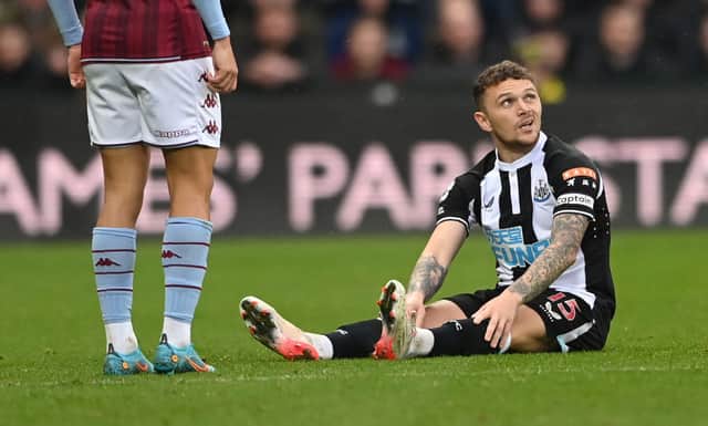 Newcastle full back Kieran Trippier sits down on the turf before leaving the field with an injury during the Premier League match between Newcastle United and Aston Villa at St. James Park on February 13, 2022 in Newcastle upon Tyne, England. 