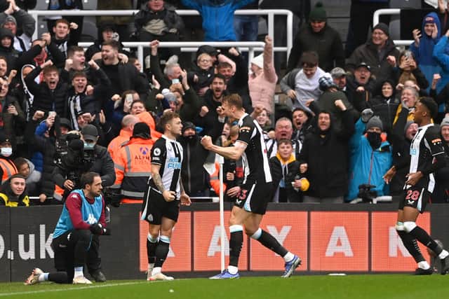 Newcastle full back Kieran Trippier (l) celebrates after scoring the winning goal from a free kick during the Premier League match between Newcastle United and Aston Villa at St. James Park on February 13, 2022 in Newcastle upon Tyne, England. 