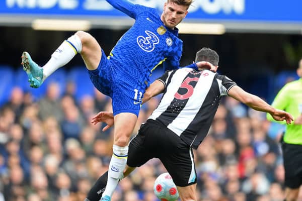 Fabian Schar of Newcastle United is challenged by Timo Werner of Chelsea during the Premier League match between Chelsea and Newcastle United at Stamford Bridge on March 13, 2022 in London, England.