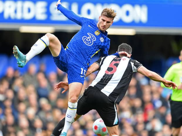Fabian Schar of Newcastle United is challenged by Timo Werner of Chelsea during the Premier League match between Chelsea and Newcastle United at Stamford Bridge on March 13, 2022 in London, England.