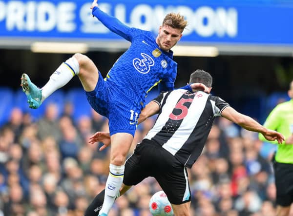 Fabian Schar of Newcastle United is challenged by Timo Werner of Chelsea during the Premier League match between Chelsea and Newcastle United at Stamford Bridge on March 13, 2022 in London, England.