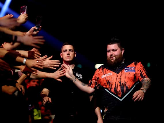 Michael ‘Bully Boy’ Smith of England walks out before he competes against Michael ‘Mighty Mike’ van Gerwen of Netherlands. Photo: Dean Mouhtaropoulos/Getty Images