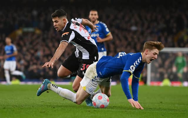 Anthony Gordon of Everton reacts after being challenged by Bruno Guimaraes of Newcastle United during the Premier League match between Everton and Newcastle United at Goodison Park on March 17, 2022 in Liverpool, England.