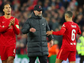 Jurgen Klopp, Manager of Liverpool embraces with Thiago Alcantara of Liverpool during the UEFA Champions League Semi Final Leg One match between Liverpool and Villarreal at Anfield on April 27, 2022 in Liverpool, England.
