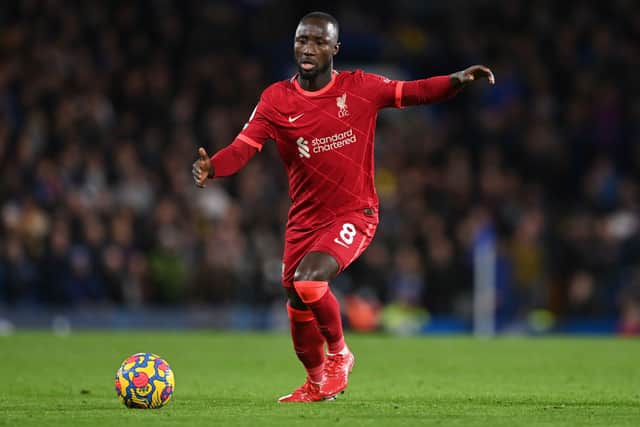 Naby Keita of Liverpool runs with the ball during the Premier League match between Chelsea  and  Liverpool at Stamford Bridge on January 02, 2022 in London, England. (Photo by Shaun Botterill/Getty Images)