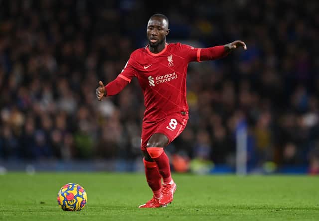 Naby Keita of Liverpool runs with the ball during the Premier League match between Chelsea  and  Liverpool at Stamford Bridge on January 02, 2022 in London, England. (Photo by Shaun Botterill/Getty Images)