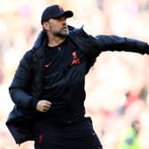 Jurgen Klopp, Manager of Liverpool celebrates with the fans after their sides victory during the Premier League match between Liverpool and Everton at Anfield on April 24, 2022 in Liverpool, England.