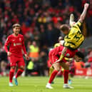 Juraj Kucka of Watford FC clashes with Curtis Jones of Liverpool when heading the ball during the Premier League match between Liverpool and Watford at Anfield on April 02, 2022 in Liverpool, England.