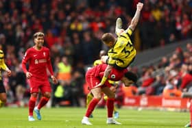 Juraj Kucka of Watford FC clashes with Curtis Jones of Liverpool when heading the ball during the Premier League match between Liverpool and Watford at Anfield on April 02, 2022 in Liverpool, England.