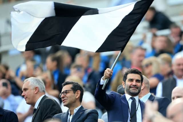 Mehrdad Ghodoussi, husband of Newcastle United’s English minority owner Amanda Staveley waves a flag in the crowd ahead of the English Premier League football match between Newcastle United and Leicester City at St James’ Park in Newcastle-upon-Tyne, north east England on April 17, 2022.