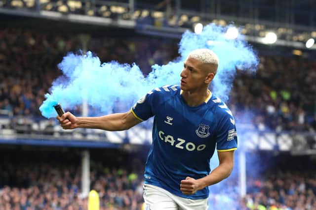 Richarlison of Everton celebrates with a flare after scoring their team’s first goal during the Premier League match between Everton and Chelsea at Goodison Park on May 01, 2022 in Liverpool, England. (Photo by Jan Kruger/Getty Images)