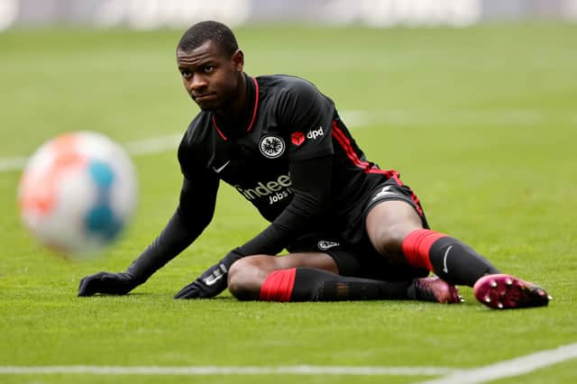 Evan N’Dicka of Frankfurt lies on the pitch during the Bundesliga match between Eintracht Frankfurt and SpVgg Greuther Fürth at Deutsche Bank Park on April 02, 2022 in Frankfurt am Main, Germany.