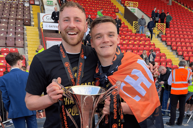 Louis Storey (L) and Owen Bailey (R) with the National League North champions trophy