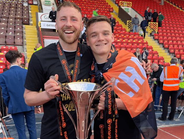 Louis Storey (L) and Owen Bailey (R) with the National League North champions trophy