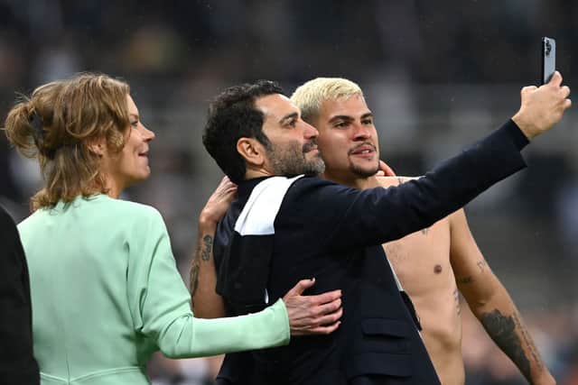 Newcastle United co-owners Amanda Staveley and Mehrdad Ghodoussi take a selfie with Bruno Guimaraes. 
