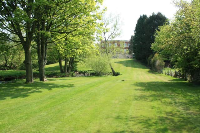 The grounds have access to its private patch of river (Image: Rightmove)