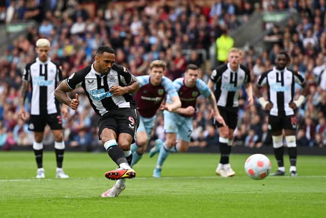 Callum Wilson of Newcastle United scores their side’s first goal from the penalty spot during the Premier League match between Burnley and Newcastle United at Turf Moor on May 22, 2022 in Burnley, England.