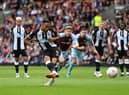 Callum Wilson of Newcastle United scores their side’s first goal from the penalty spot during the Premier League match between Burnley and Newcastle United at Turf Moor on May 22, 2022 in Burnley, England.