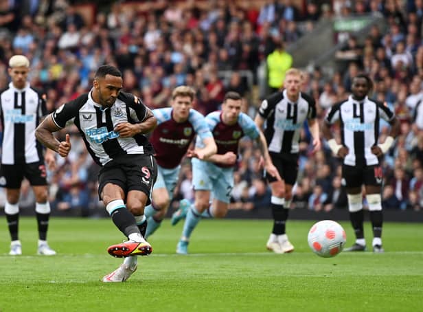 <p>Callum Wilson of Newcastle United scores their side’s first goal from the penalty spot during the Premier League match between Burnley and Newcastle United at Turf Moor on May 22, 2022 in Burnley, England.</p>