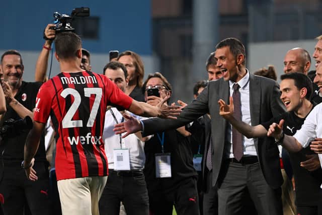 Paolo Maldini, Technical Director of AC Milan (R) congratulates his son Daniel Maldini of AC Milan (L) after their side finished the season as Serie A champions during the Serie A match between US Sassuolo and AC Milan at Mapei Stadium - Citta’ del Tricolore on May 22, 2022 in Reggio nell’Emilia, Italy. 