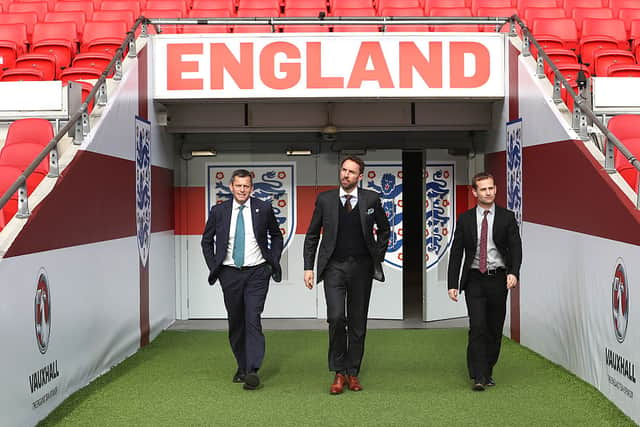 FA Chief Executive Martin Glenn (L) and FA Technical Director Dan Ashworth (R) walk alongside Gareth Southgate as he is unveiled as the new England manager at Wembley Stadium on December 1, 2016 in London, England. 