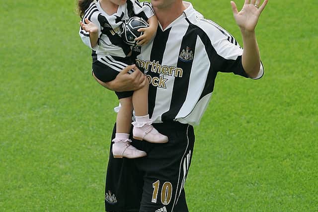 Newcastle United’s new signing Michael Owen holds his daughter, Gemma, as he is introduced to the fans at St James’ Park on August 31, 2005 in Newcastle, England (Photo by Alex Livesey/Getty Images)