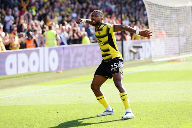 Emmanuel Dennis of Watford FC celebrates after scoring their team's first goal during the Premier League (Photo by Luke Walker/Getty Images)