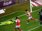 Reims French forward Hugo Ekitike (C) shoot and scores during the French L1 football match Reims and Bordeaux at the Auguste Delaune Stadium in Reims on February 6, 2022.