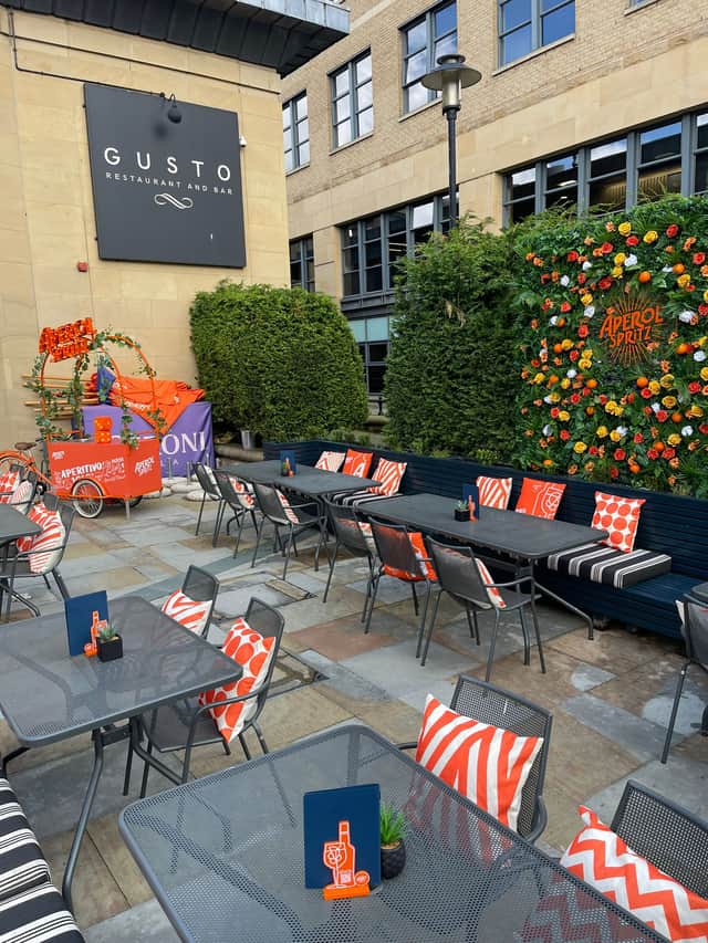 The terrace is orange-themed