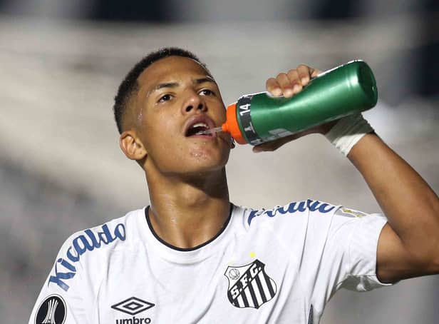 <p>Brazil’s Santos Angelo Gabriel has some water during the Copa Libertadores football tournament group stage match against Argentina’s Boca Juniors at Vila Belmiro stadium in Santos, Brazil, on May 11, 2021. </p>