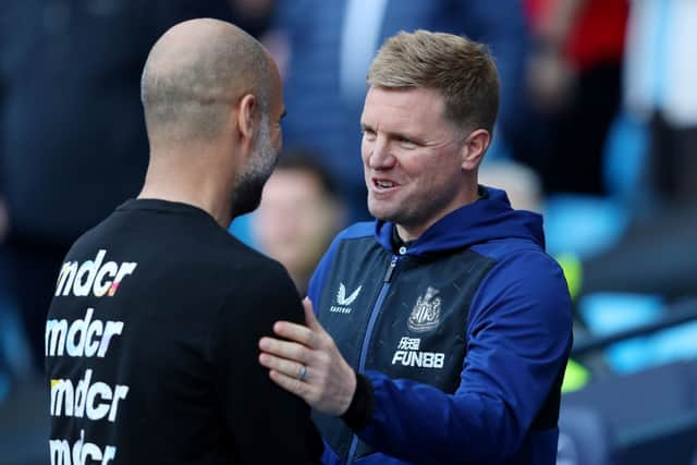 Pep Guardiola, Manager of Manchester City, shakes hands with Eddie Howe, Manager of Newcastle United, prior to kick off of the Premier League match between Manchester City and Newcastle United at Etihad Stadium on May 08, 2022.