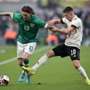 Jeff Hendrick of Republic Of Ireland is challenged by Thorgan Hazard of Belgium during the International Friendly match between Republic of Ireland and Belgium at Aviva Stadium on March 26, 2022 in Dublin, Ireland.