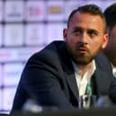 Footballer Michael Chopra of Kerala Blasters FC sits with Shirish Kulkarni, President of Liverpool International Football Academy DSK-Shivajians, right,  as they attend the Soccerex European Forum Conference Programme at Manchester Central on September 8, 2014 in Manchester, England. 