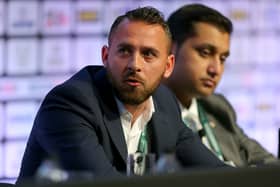 Footballer Michael Chopra of Kerala Blasters FC sits with Shirish Kulkarni, President of Liverpool International Football Academy DSK-Shivajians, right,  as they attend the Soccerex European Forum Conference Programme at Manchester Central on September 8, 2014 in Manchester, England. 
