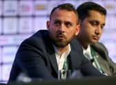 Footballer Michael Chopra of Kerala Blasters FC sits with Shirish Kulkarni, President of Liverpool International Football Academy DSK-Shivajians, right,  as they attend the Soccerex European Forum Conference Programme at Manchester Central on September 8, 2014 in Manchester, England. 