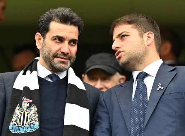 <p>Newcastle United directors Mehrdad Ghodoussi (L) and Jamie Reuben react in the stands ahead of English Premier League football match between Chelsea and Newcastle United at Stamford Bridge in London on March 13, 2022. </p>