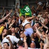 Raphinha of Leeds United celebrates with the fans after avoiding relegation following victory  in the Premier League match between Brentford and Leeds United at Brentford Community Stadium on May 22, 2022 in Brentford, England.