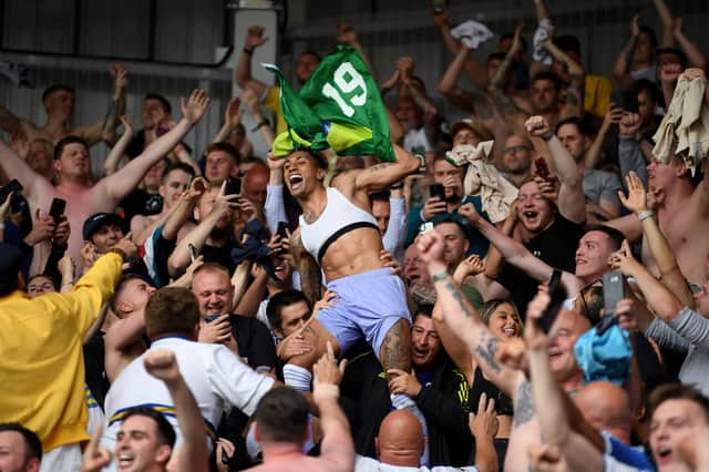 Raphinha of Leeds United celebrates with the fans after avoiding relegation following victory in the Premier League match between Brentford and Leeds United at Brentford Community Stadium on May 22, 2022 in Brentford, England.